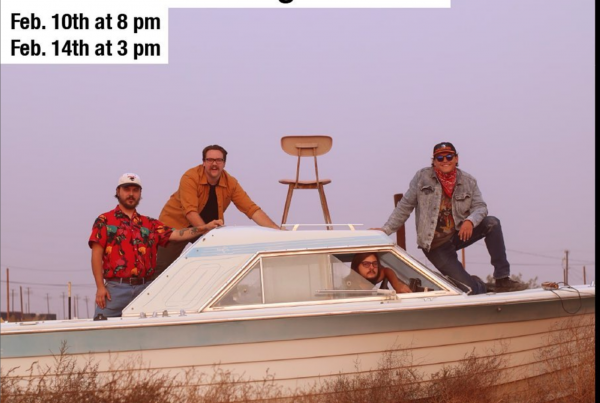 A photo of the Will Shamberger Band posed on a boat.
